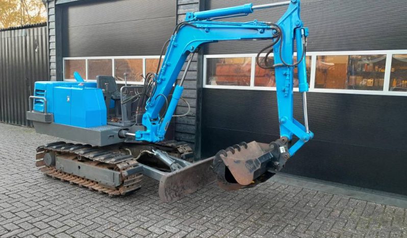 Yanmar YB 301 minigraver met CW05 en 3 bakken vol