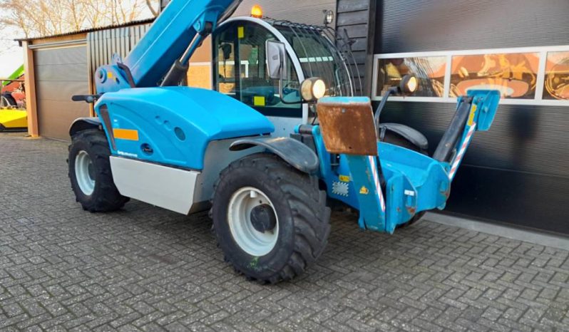 Genie GTH 4013 SX verreiker met bak en vorken vol