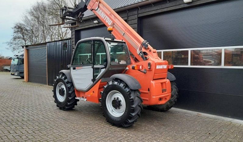 Manitou MT 932 verreiker met vorken vol