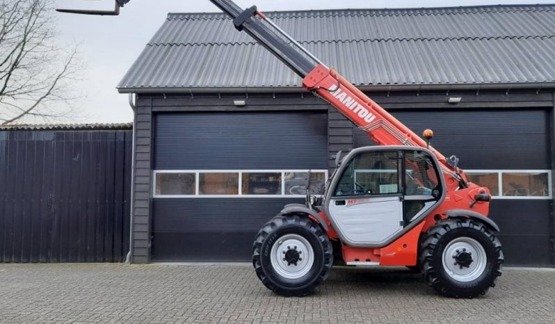 Manitou MT 932 verreiker met vorken vol