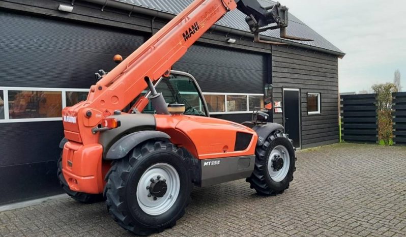 Manitou MT 932 verreiker met vorken vol