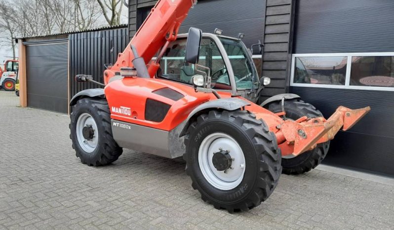Manitou MT 1030 S verreiker – Grondbak + Vorken vol